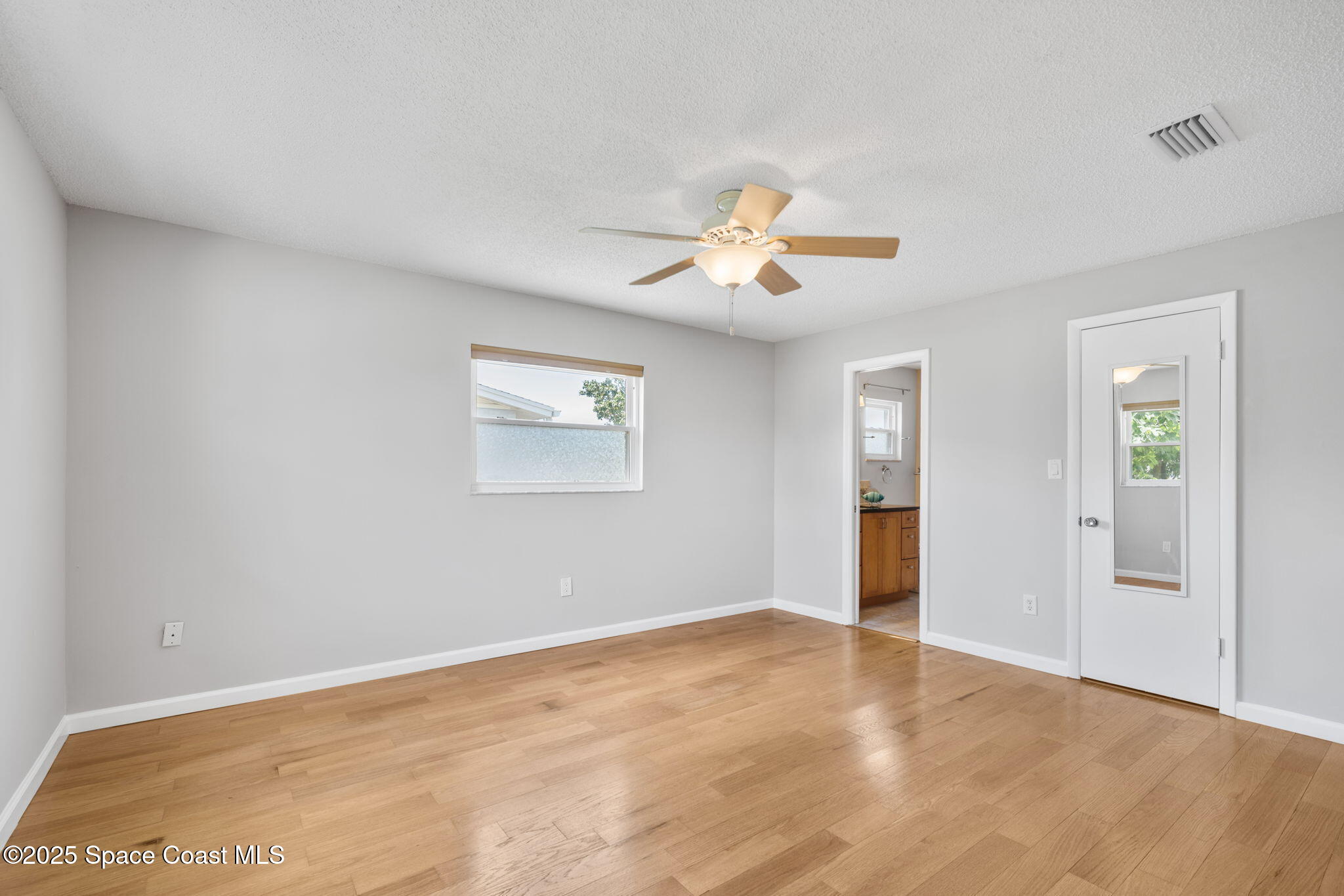 437 Eagle Drive Satellite Beach, FL 32937 - Photo 16 of 30 a view of an empty room with a window