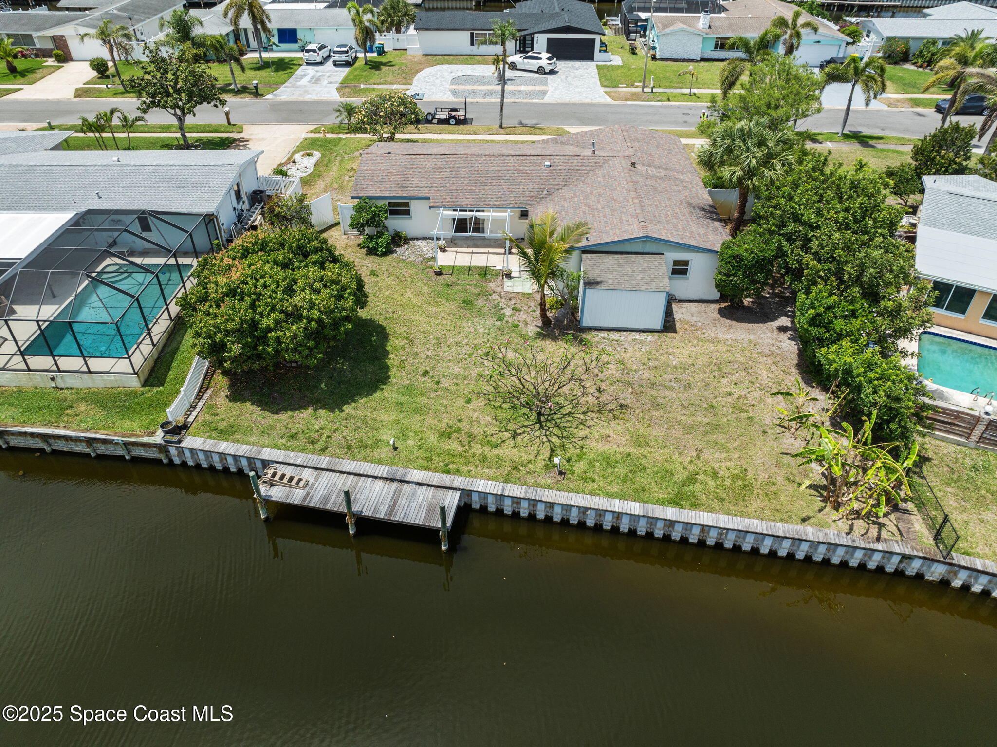437 Eagle Drive Satellite Beach, FL 32937 - Photo 2 of 30 an aerial view of residential houses with outdoor space