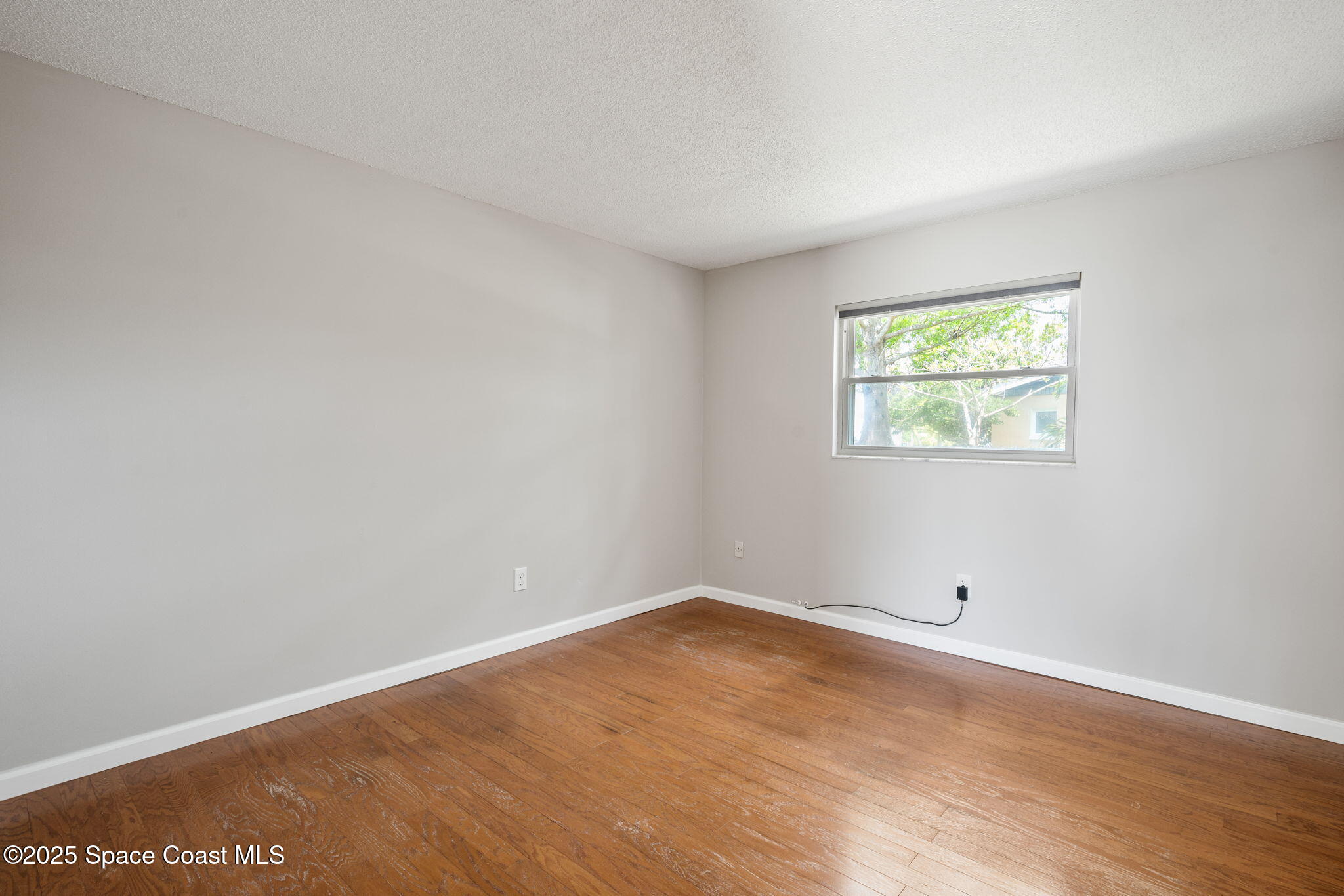 437 Eagle Drive Satellite Beach, FL 32937 - Photo 19 of 30 an empty room with a window