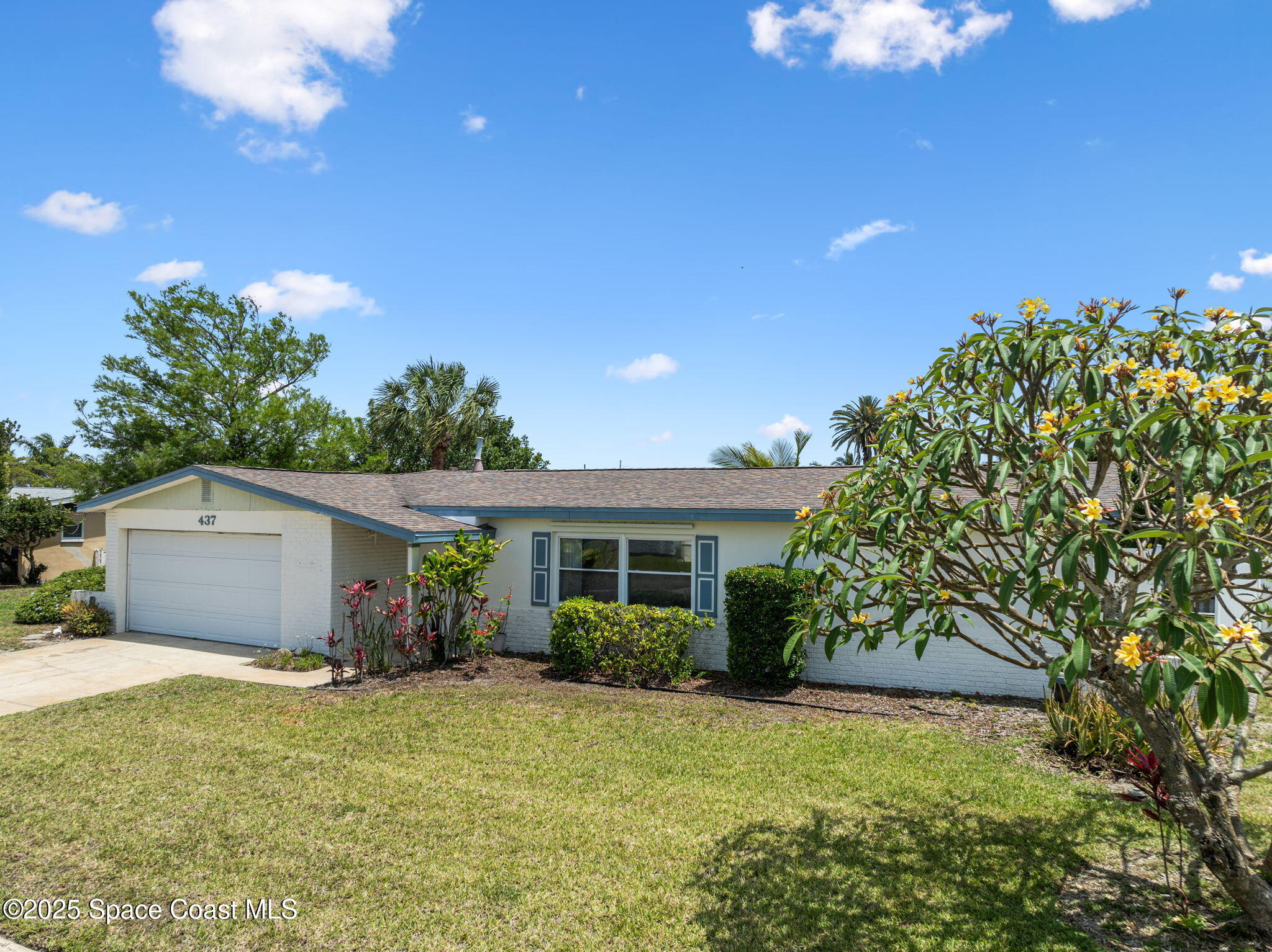 437 Eagle Drive Satellite Beach, FL 32937 - Photo 22 of 30 a view of a house with backyard and garden