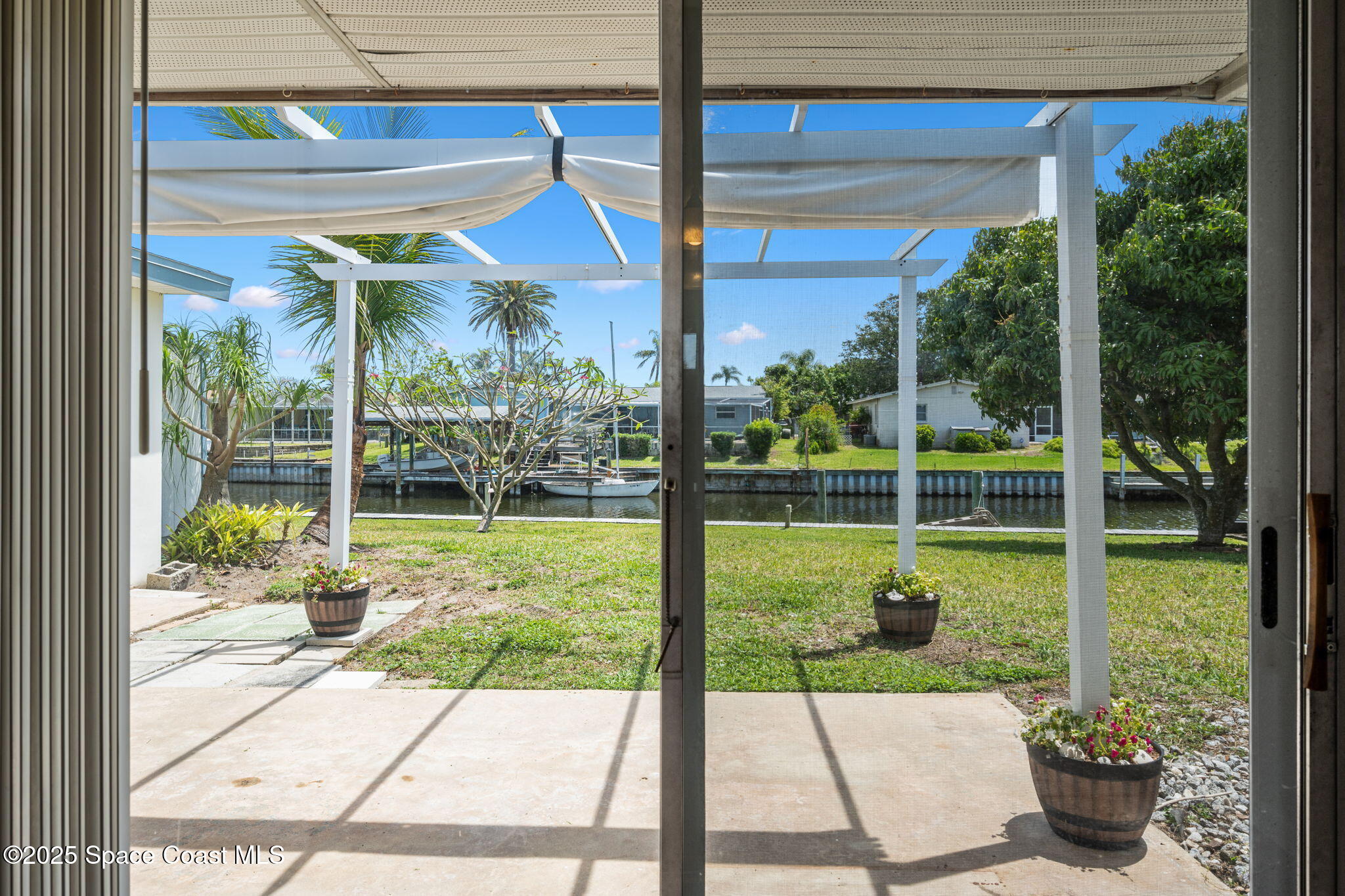 437 Eagle Drive Satellite Beach, FL 32937 - Photo 23 of 30 a view of a porch with furniture and garden