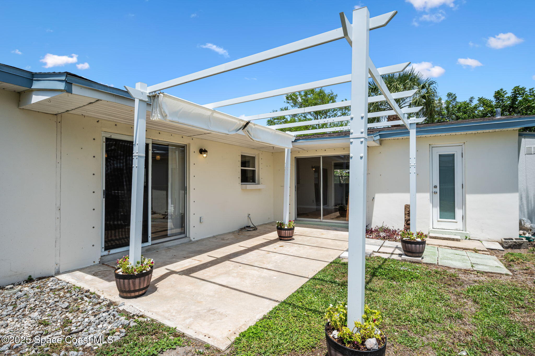 437 Eagle Drive Satellite Beach, FL 32937 - Photo 25 of 30 a house view with a sitting space