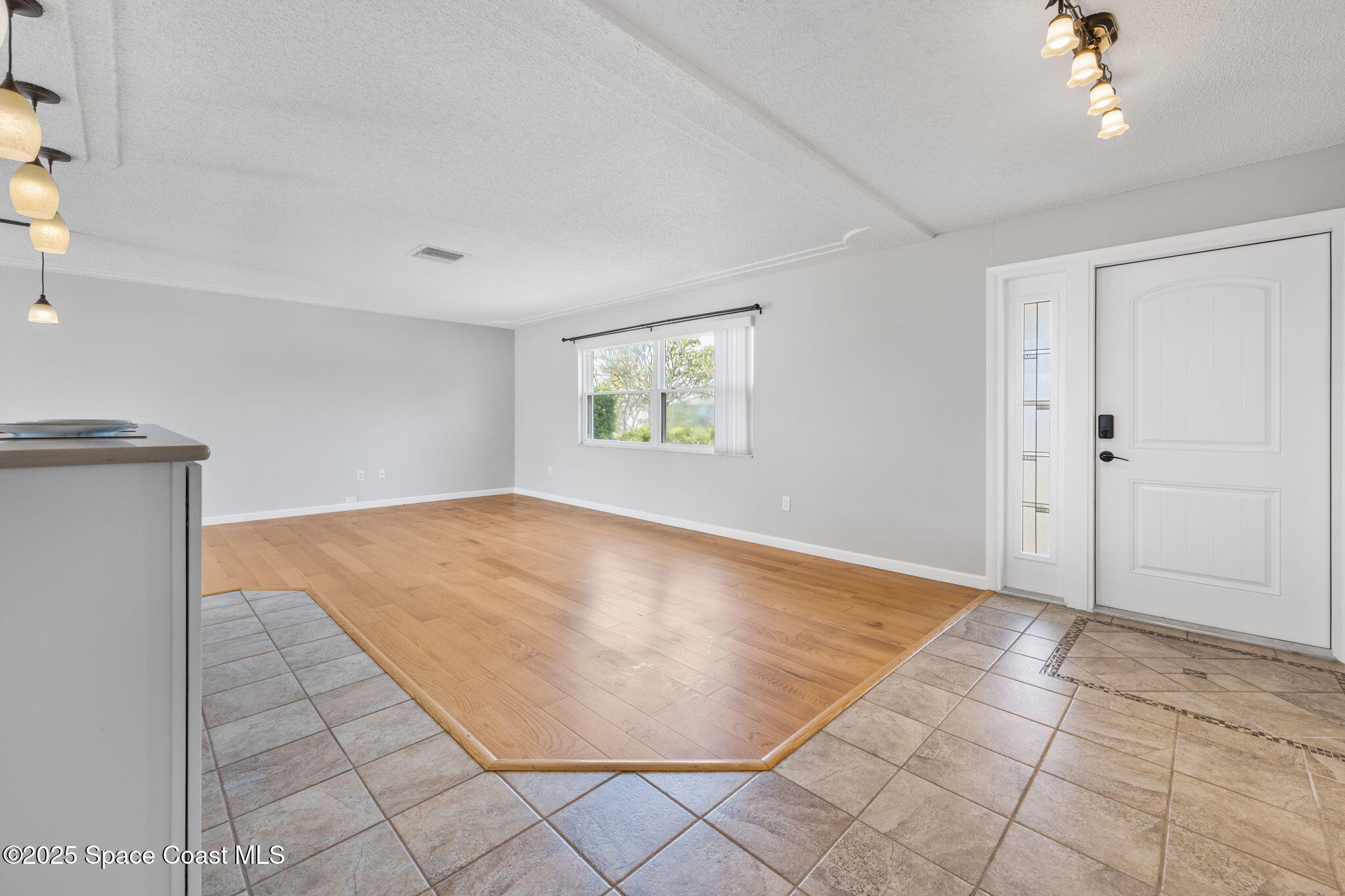 437 Eagle Drive Satellite Beach, FL 32937 - Photo 5 of 30 an empty room with windows