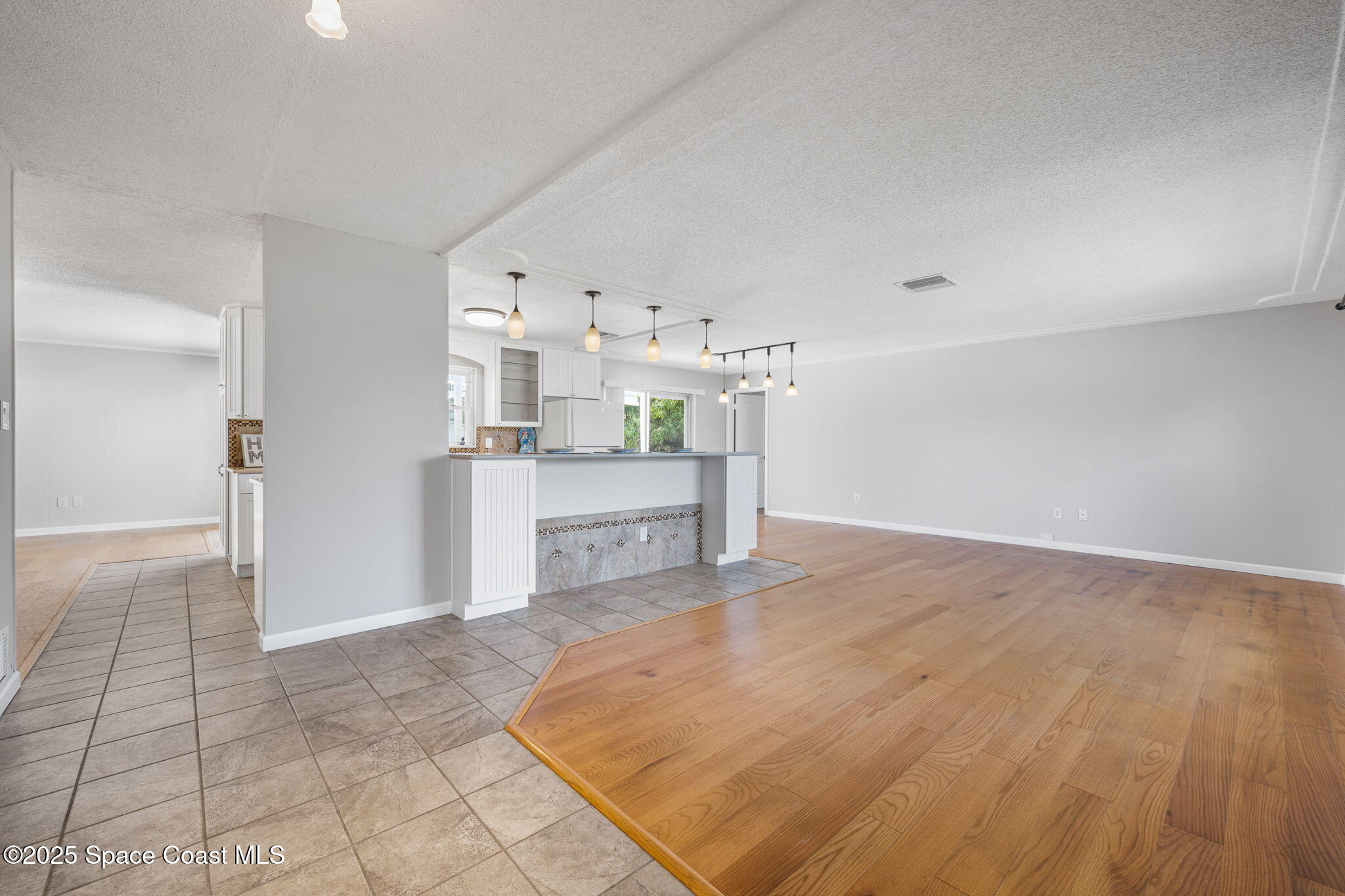 437 Eagle Drive Satellite Beach, FL 32937 - Photo 27 of 30 a kitchen with stainless steel appliances a refrigerator and a stove