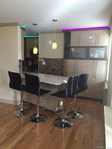 a living room with a table and chairs