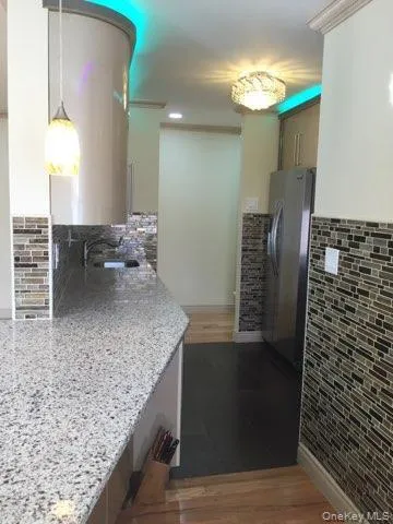 a view of a bathroom with a sink and a mirror