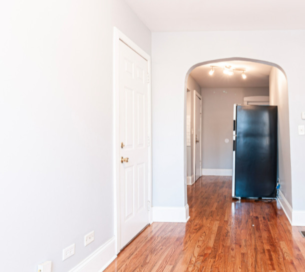 3614 West George Street, Unit 1R Chicago, IL 60618 - Photo 8 of 12 a view of a hallway with wooden floor