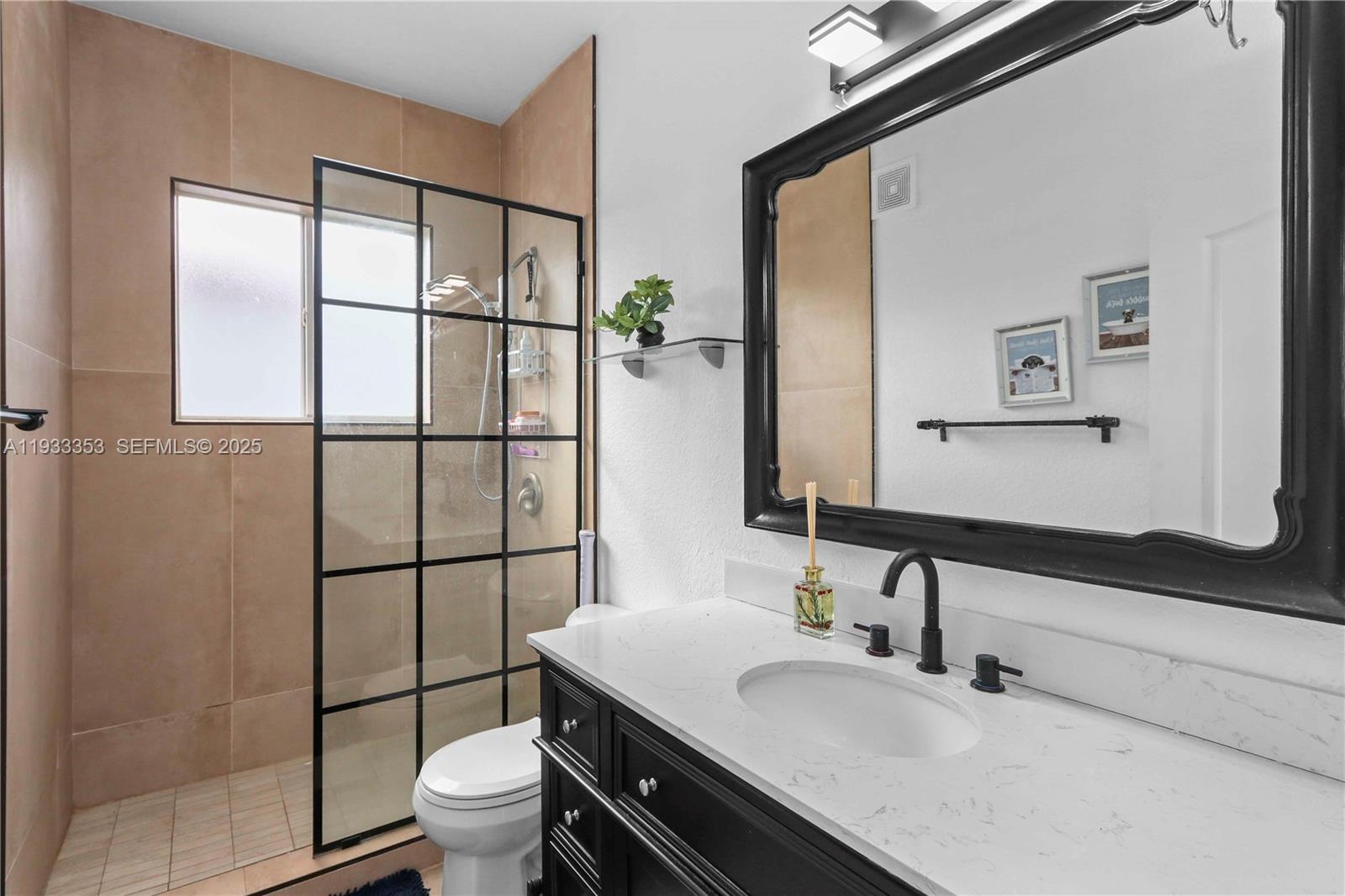 846 Southwest 148th Place Miami, FL 33194 - Photo 21 of 32 a bathroom with a sink toilet and shower