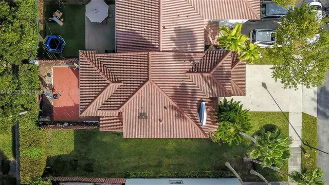 an aerial view of residential houses with outdoor space