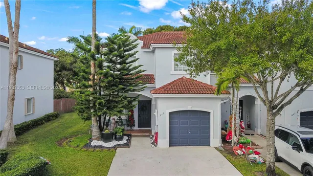 a front view of a house with garden