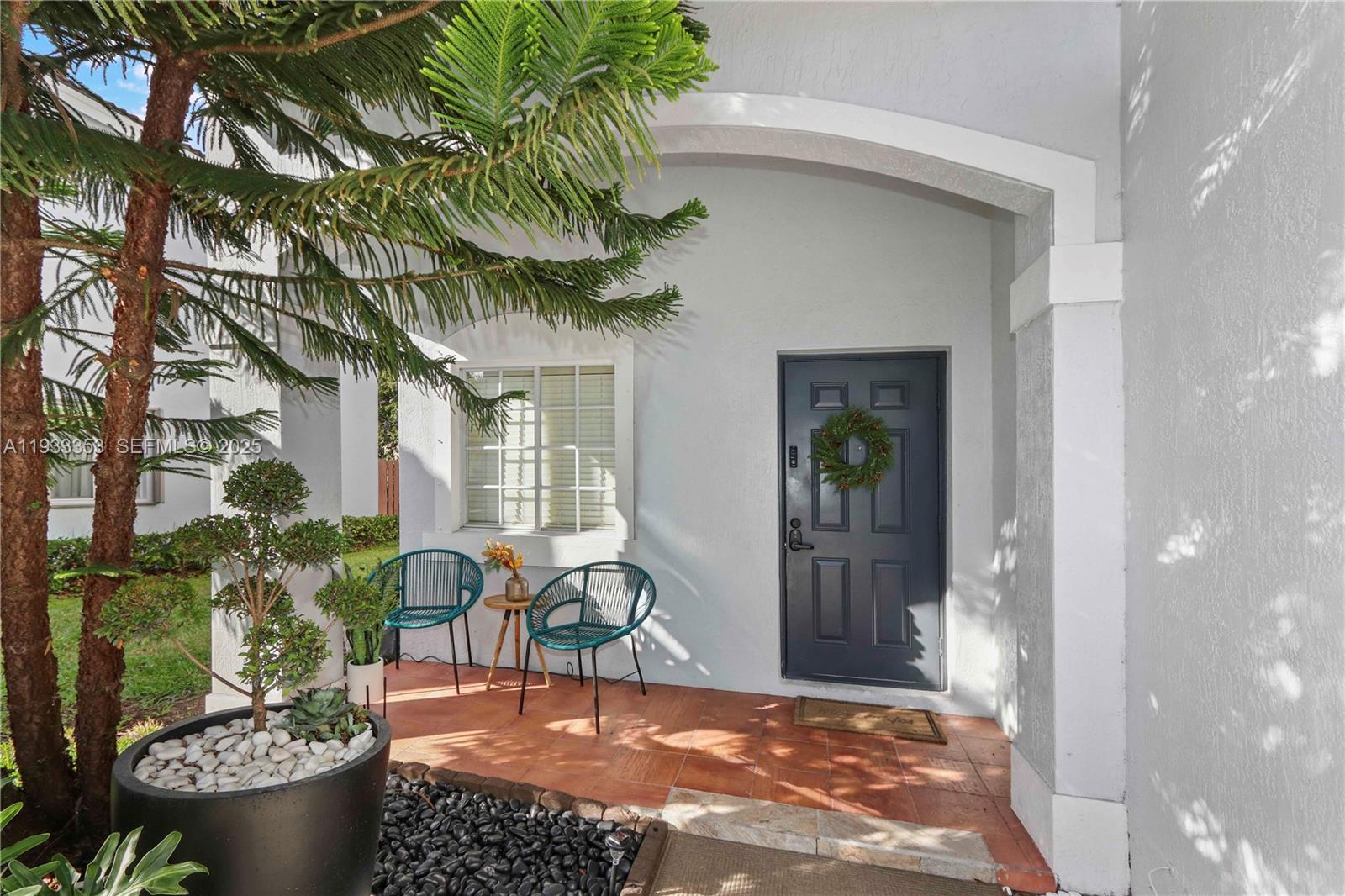 846 Southwest 148th Place Miami, FL 33194 - Photo 7 of 32 a view of a chairs and table in a patio