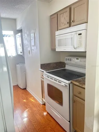 a view of a kitchen with washer and dryer