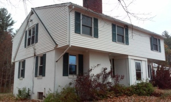 160 Draper Road East Brookfield, MA 01515 - Photo 4 of 19 a view of a white house next to a yard