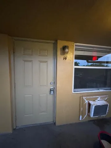 a view of a hallway with washer and dryer