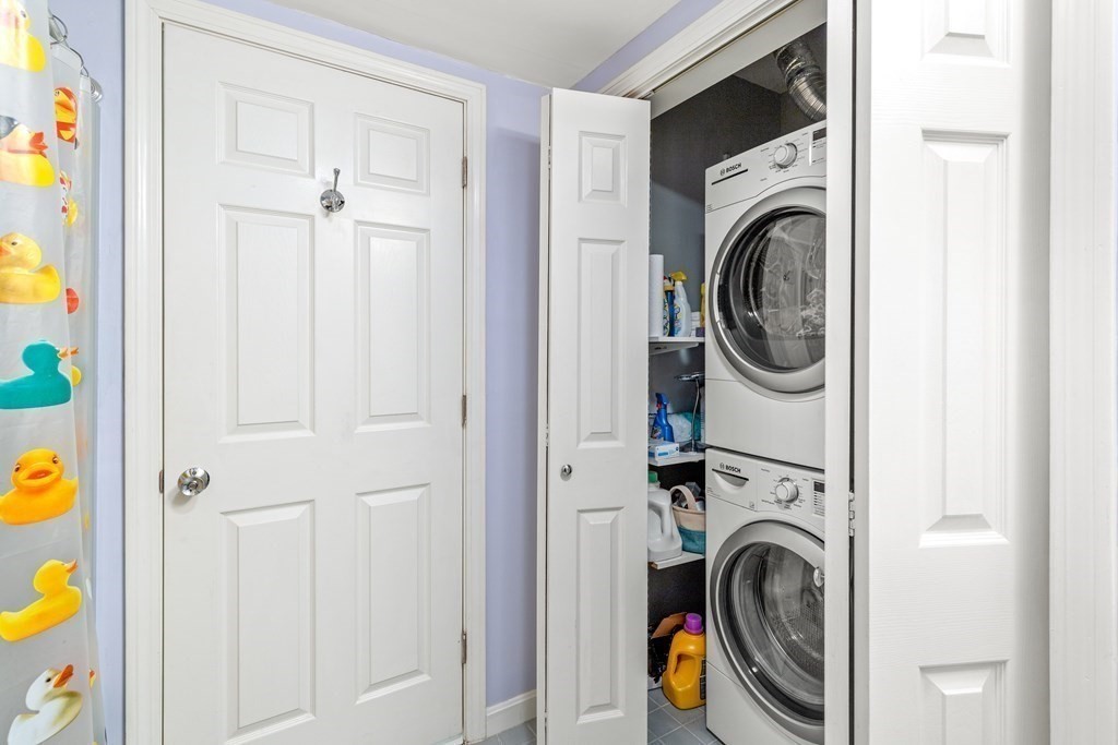 4873 Washington Street, Unit 1 Boston, MA 02132 - Photo 21 of 25 a utility room with dryer and washer
