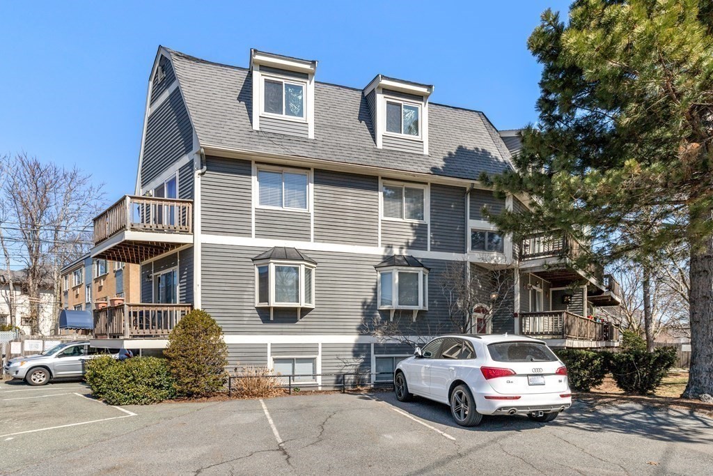 4873 Washington Street, Unit 1 Boston, MA 02132 - Photo 24 of 25 a car parked in front of a building