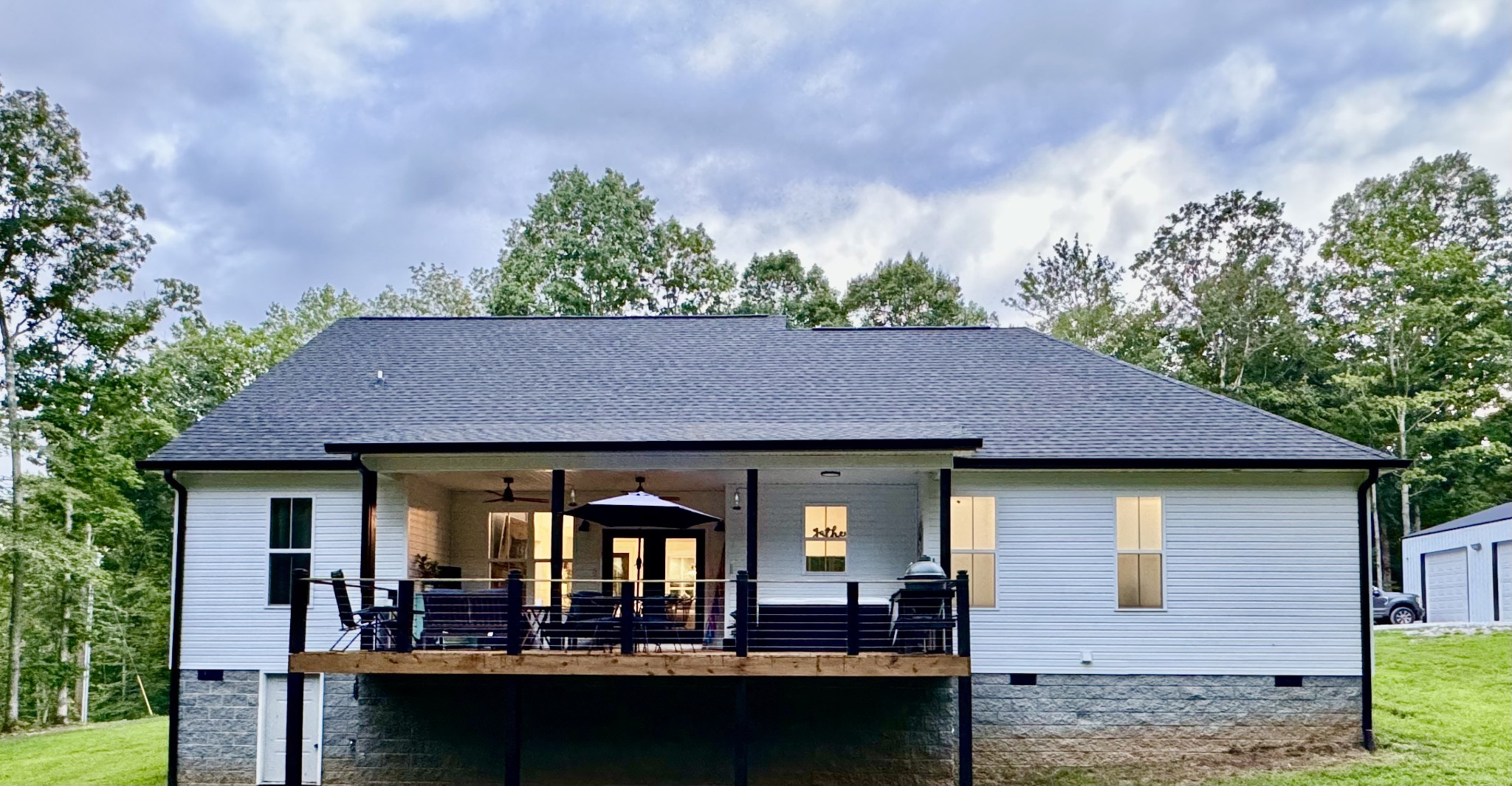 859 Lucas Road Dickson, TN 37055 - Photo 53 of 63 a view of house with swimming pool and trees in the background