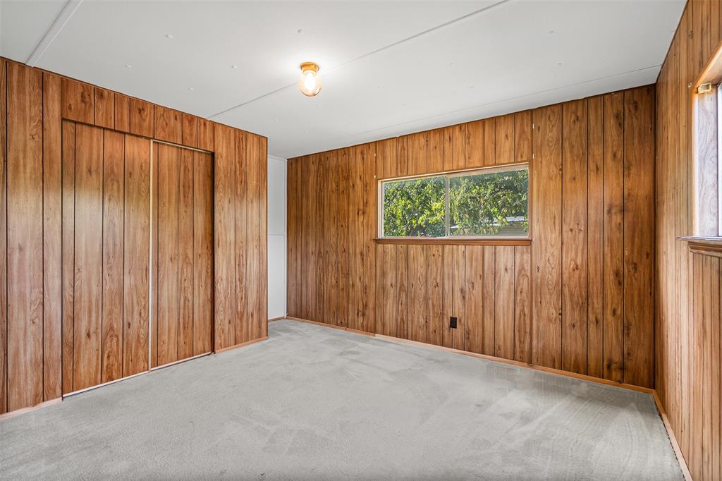 3667 Oak Circle Weatherford, TX 76088 - Photo 25 of 35 Carpeted spare room featuring wood walls