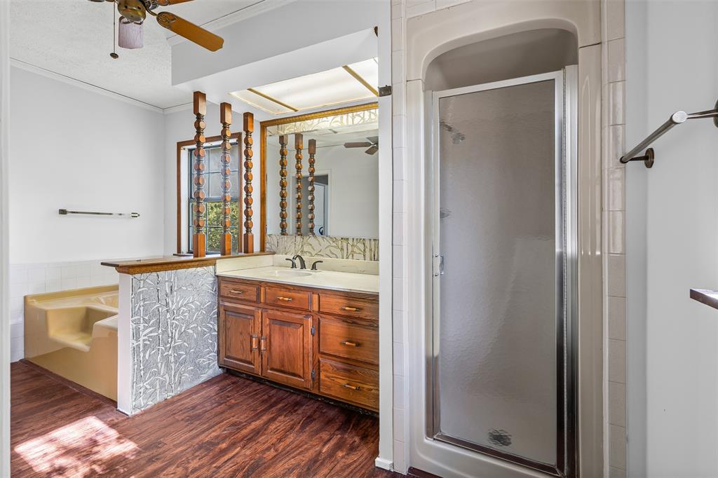 3667 Oak Circle Weatherford, TX 76088 - Photo 29 of 35 Bathroom with ornamental molding, a shower stall, a garden tub, ceiling fan, and vanity