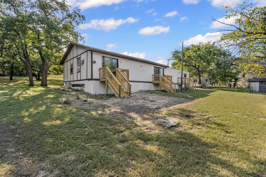 3667 Oak Circle Weatherford, TX 76088 - Photo 33 of 35 Back of property featuring a yard