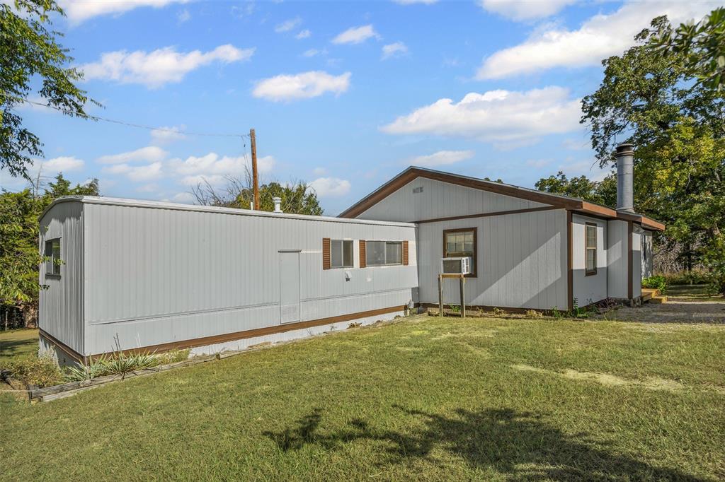 3667 Oak Circle Weatherford, TX 76088 - Photo 5 of 35 Rear view of house featuring a yard
