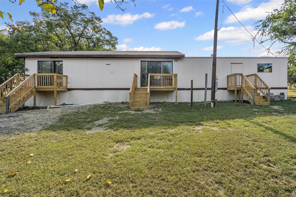 3667 Oak Circle Weatherford, TX 76088 - Photo 10 of 35 Rear view of property featuring stairs, a deck, and a yard