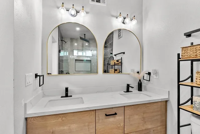a bathroom with a sink and a mirror