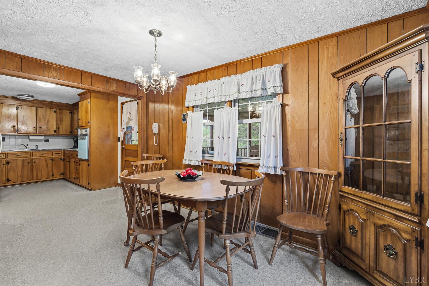 1760 Wickliffe Road Brookneal, VA 24528 - Photo 12 of 40 a view of a dining room with furniture and chandelier