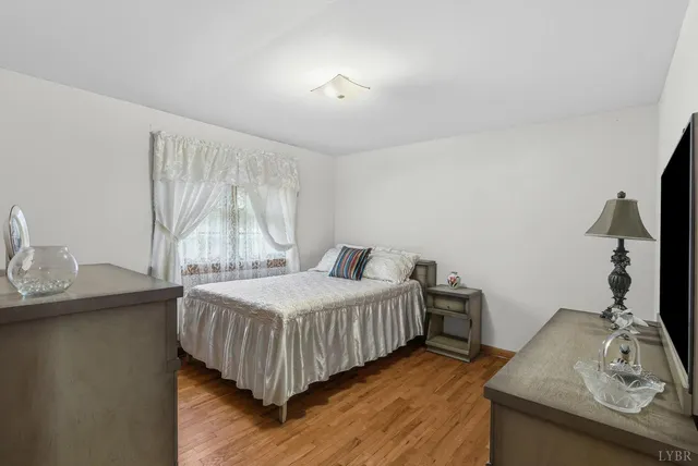 a bedroom with a bed and a table