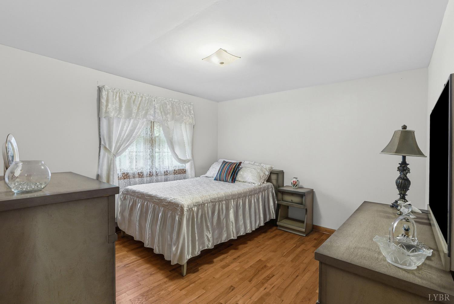 1760 Wickliffe Road Brookneal, VA 24528 - Photo 19 of 40 a bedroom with a bed and a table