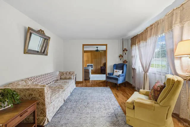 a bedroom with furniture and a fireplace