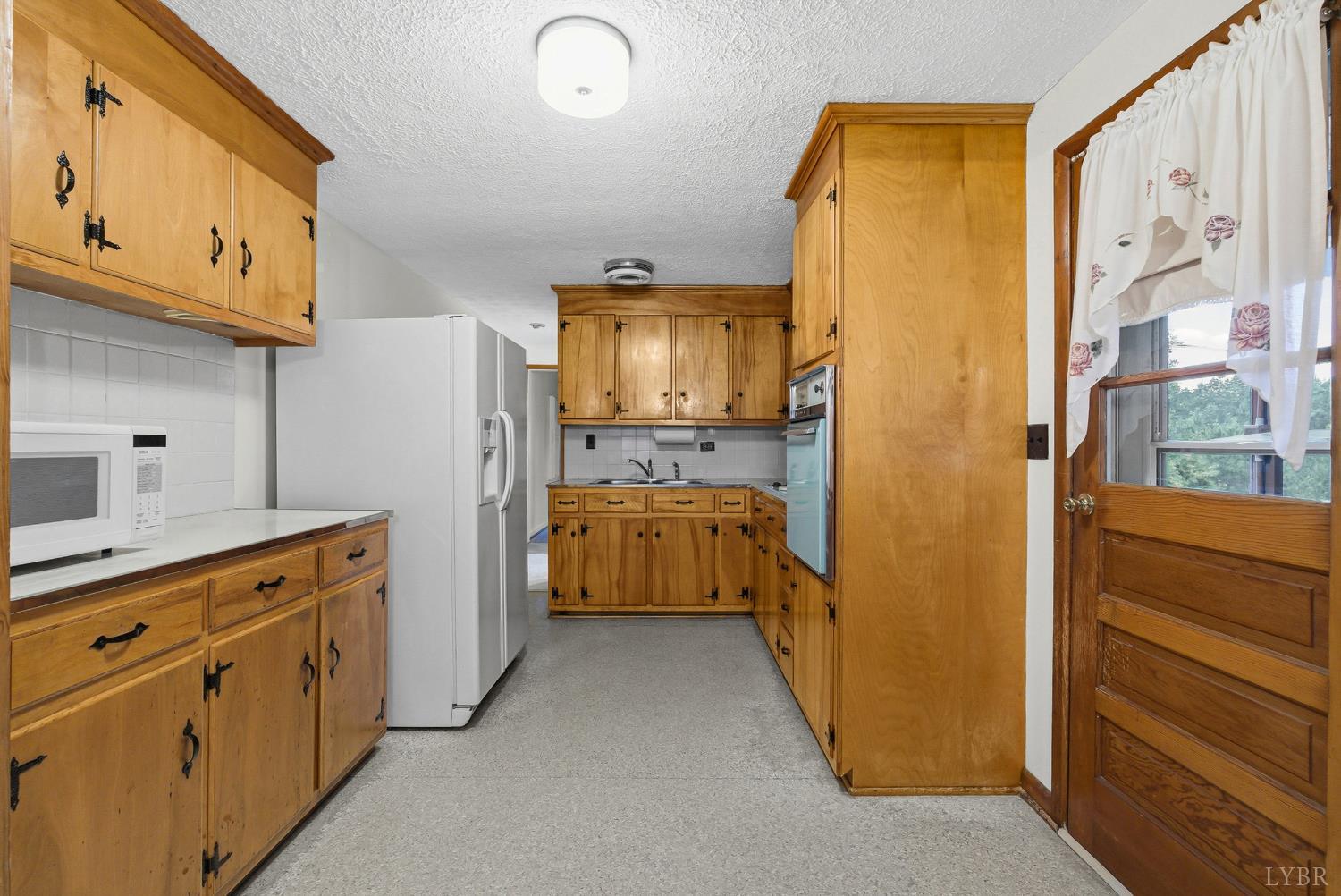1760 Wickliffe Road Brookneal, VA 24528 - Photo 8 of 40 a utility room with cabinets washer and dryer