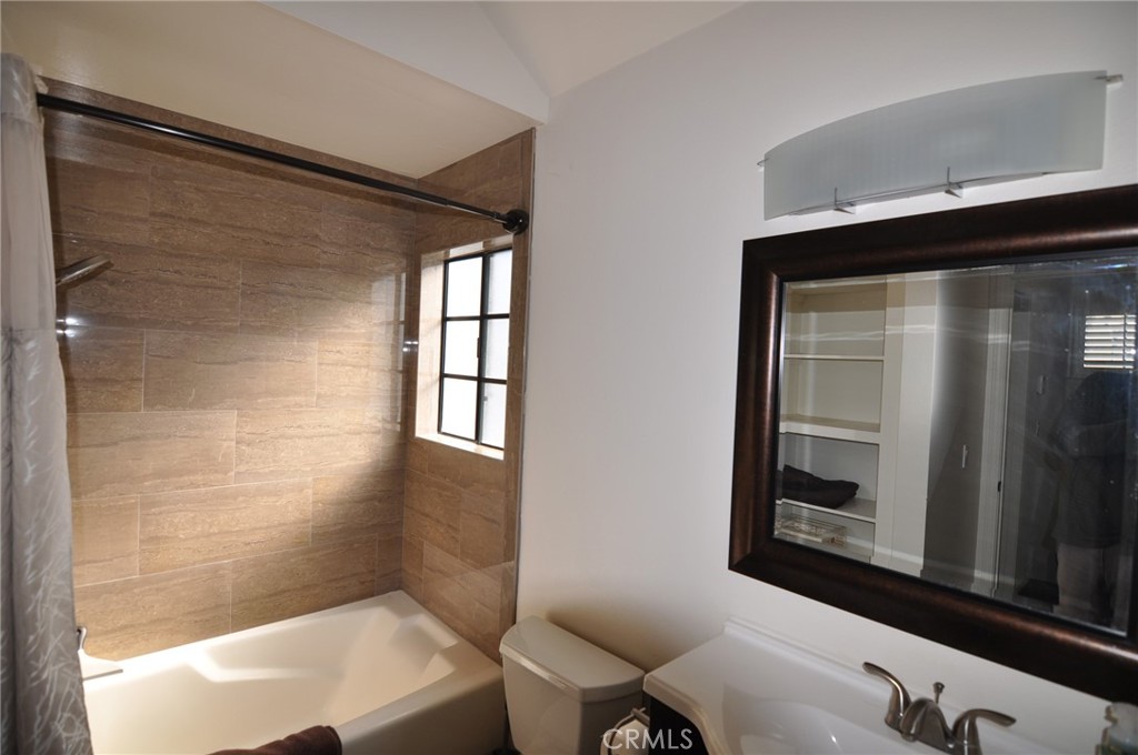 249 Alpine Street, Unit 48 Pasadena, CA 91106 - Photo 8 of 14 a bathroom with a sink and a mirror
