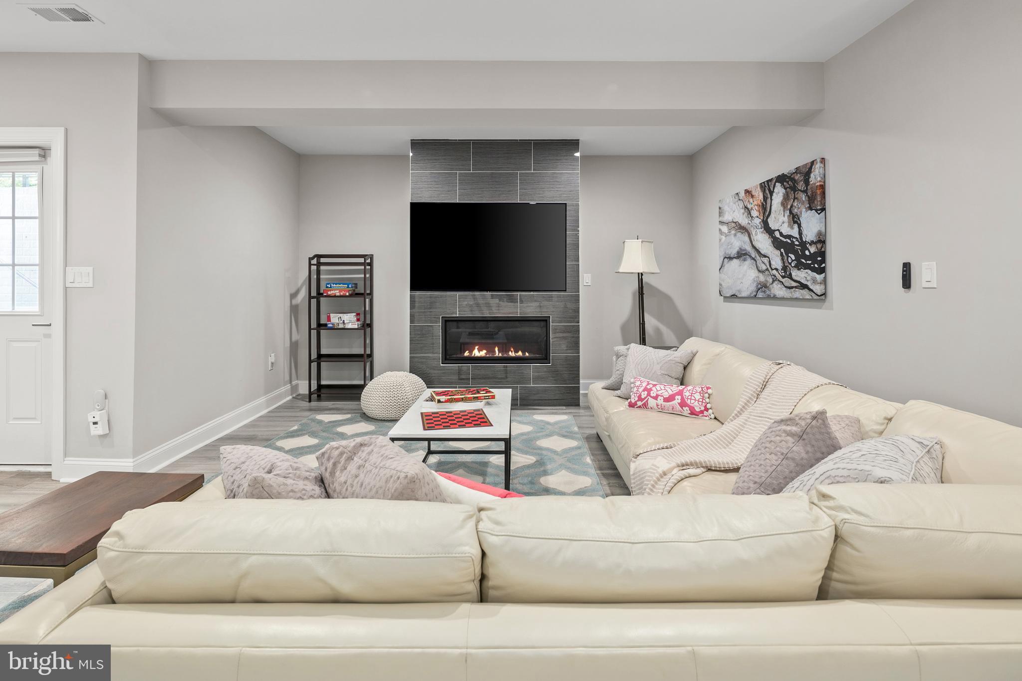 7911 Fort Hunt Road Alexandria, VA 22308 - Photo 56 of 71 Gas fireplace & wall mounted TV