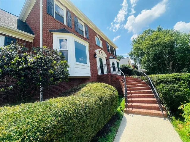 a house view with a garden space