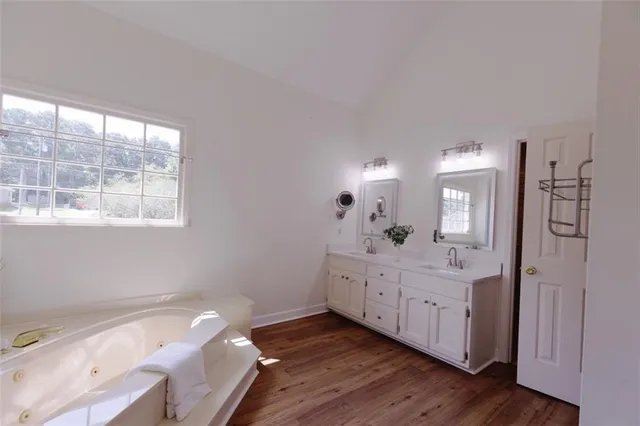 a bathroom with a bathtub and a shower
