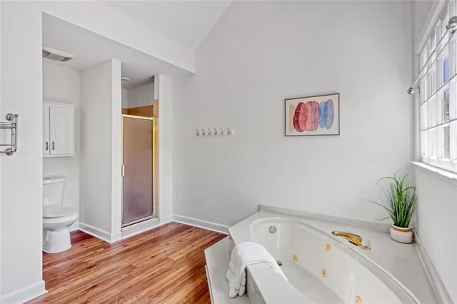 a kitchen with granite countertop a sink dishwasher stove and cabinets