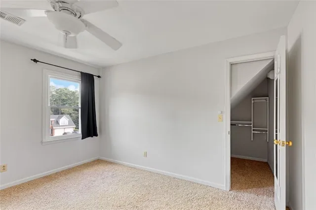 a bathroom with a sink vanity granite and toilet