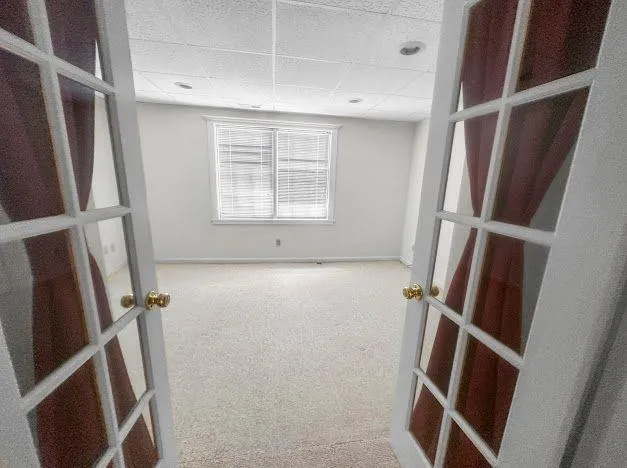 a view of empty room with windows