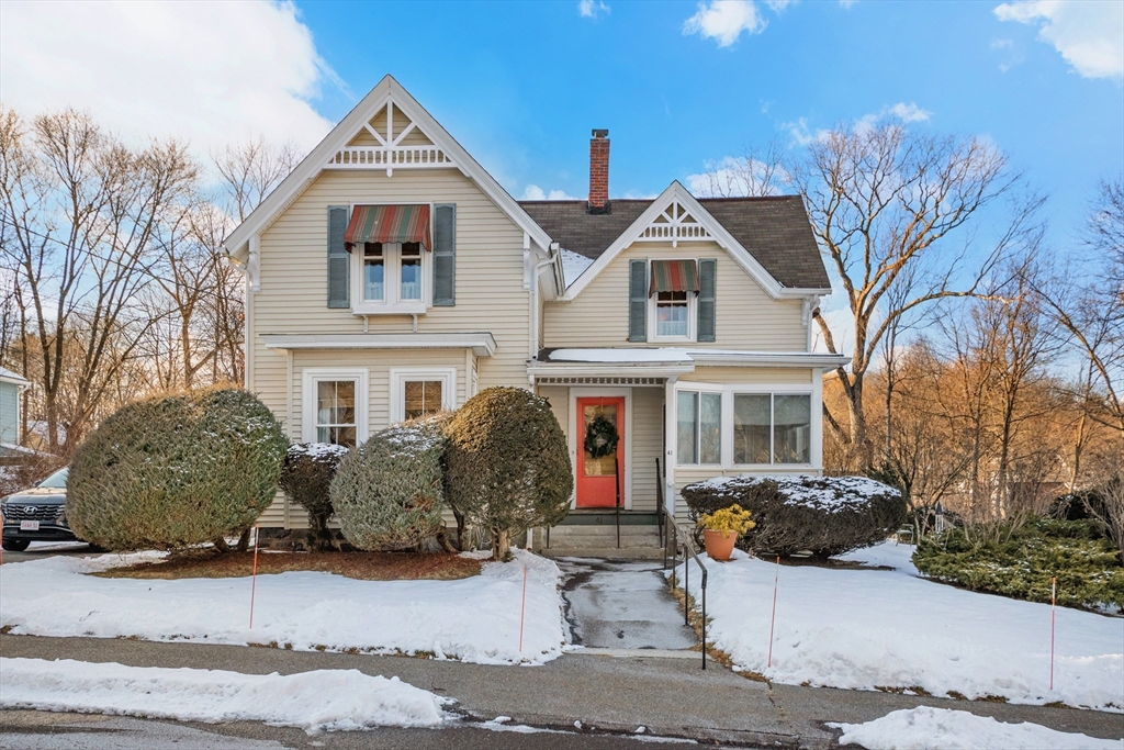 41 Walnut Street Hudson, MA 01749 - Photo 1 of 15 a front view of a house with a yard