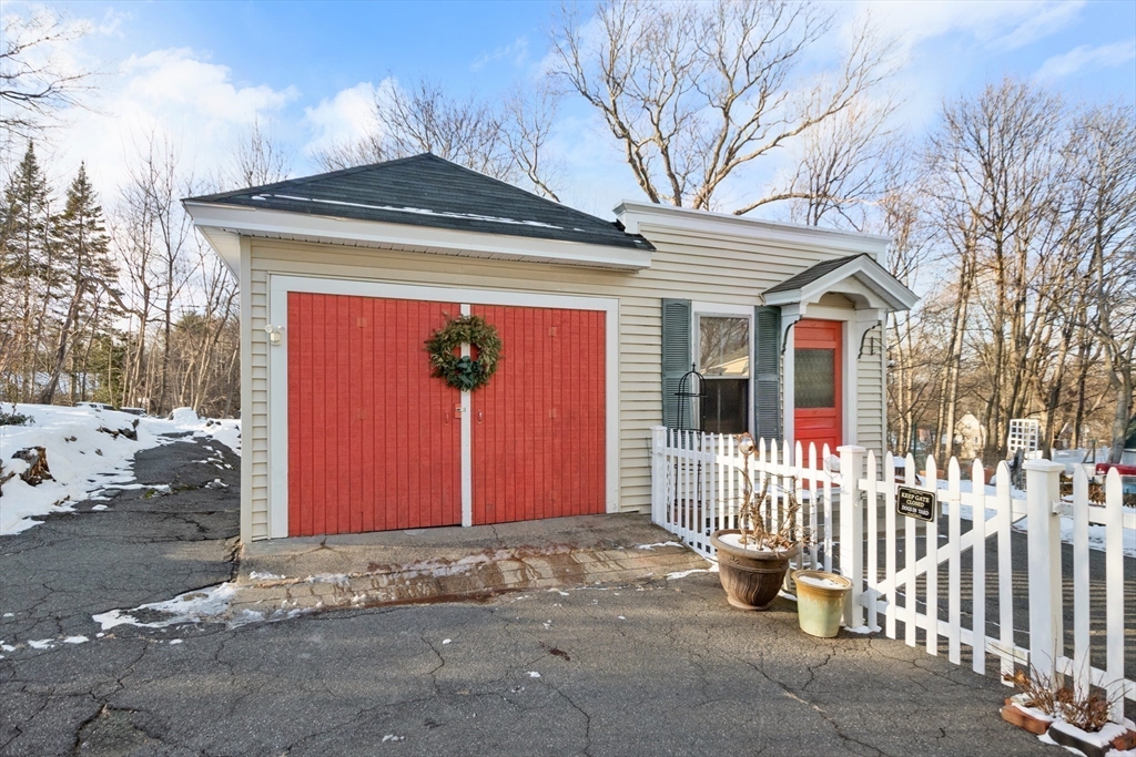 41 Walnut Street Hudson, MA 01749 - Photo 14 of 15 a front view of a house with wooden fence