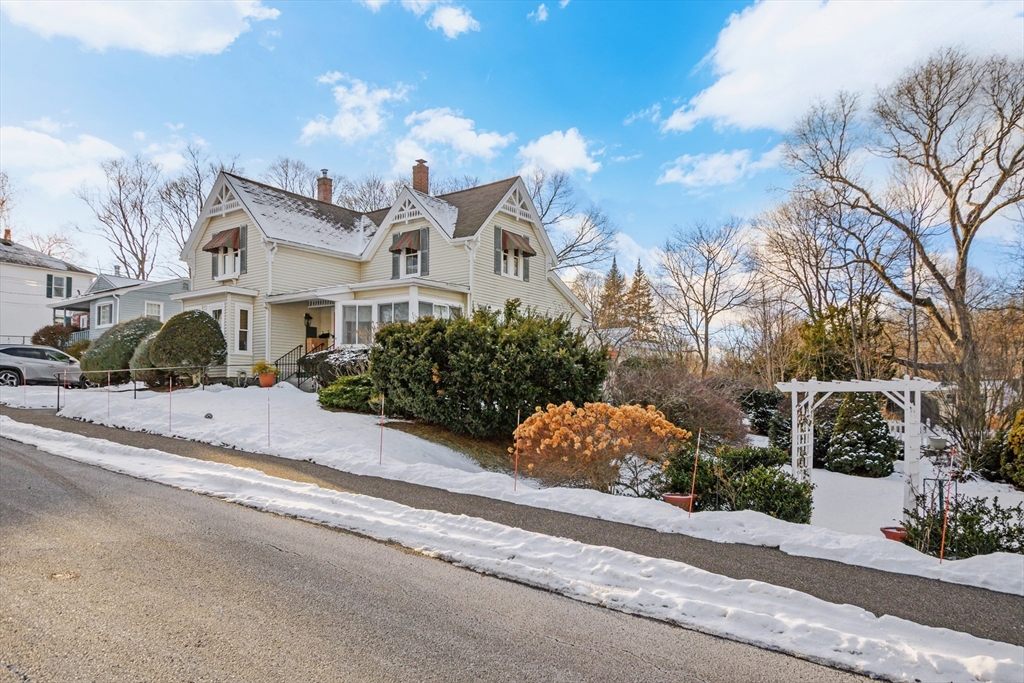 41 Walnut Street Hudson, MA 01749 - Photo 2 of 15 a front view of a house with a yard and trees
