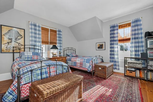 a room with granite countertop kitchen island stainless steel appliances a sink and a window