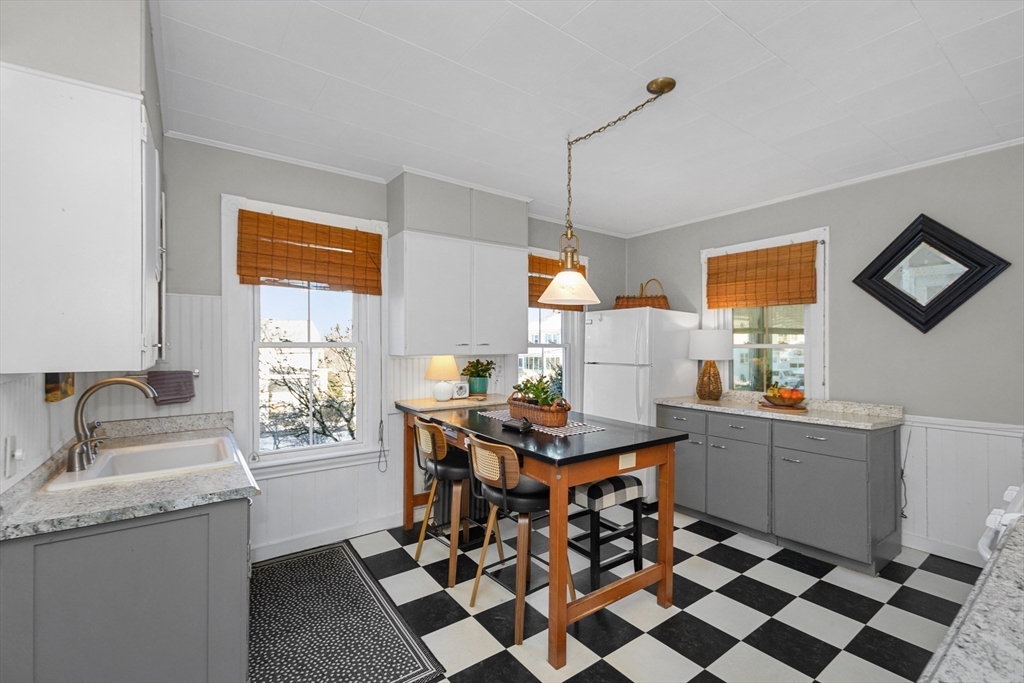 41 Walnut Street Hudson, MA 01749 - Photo 8 of 15 a room with granite countertop kitchen island stainless steel appliances a sink and a window