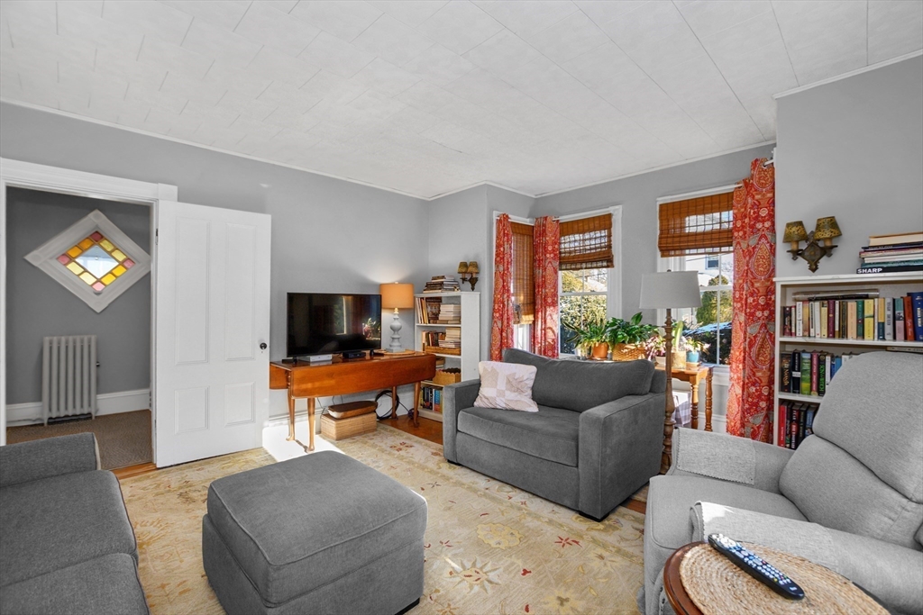 41 Walnut Street Hudson, MA 01749 - Photo 9 of 15 a living room with furniture and a flat screen tv