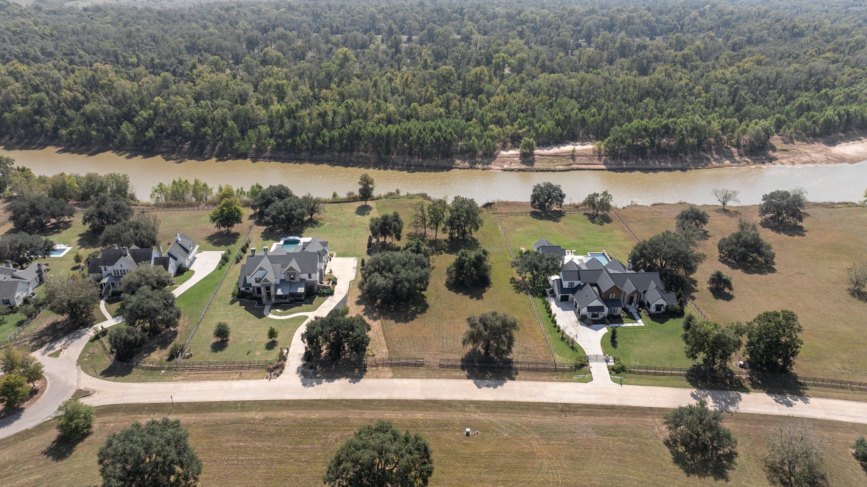 30958 Riverlake Road Fulshear, TX 77441 - Photo 3 of 9 an aerial view of multiple houses with yard