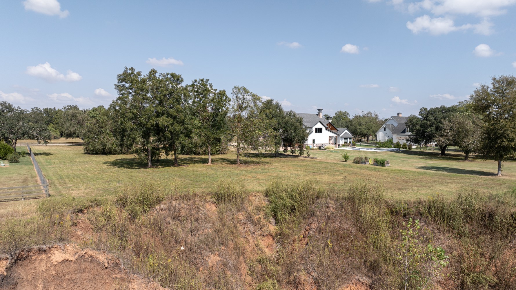 30958 Riverlake Road Fulshear, TX 77441 - Photo 5 of 9 a view of dirt field with trees