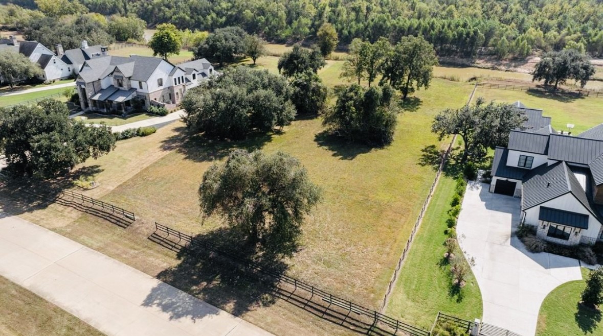 30958 Riverlake Road Fulshear, TX 77441 - Photo 6 of 9 a view of swimming pool with a yard