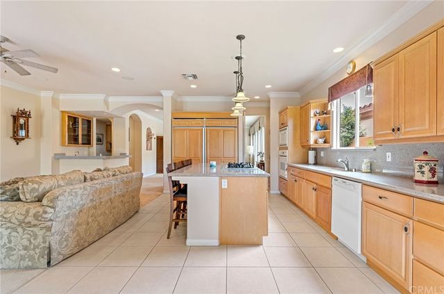 a living room with furniture window and a flat screen tv