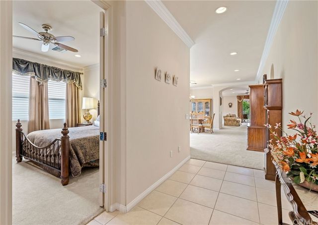 a bedroom with furniture and a chandelier